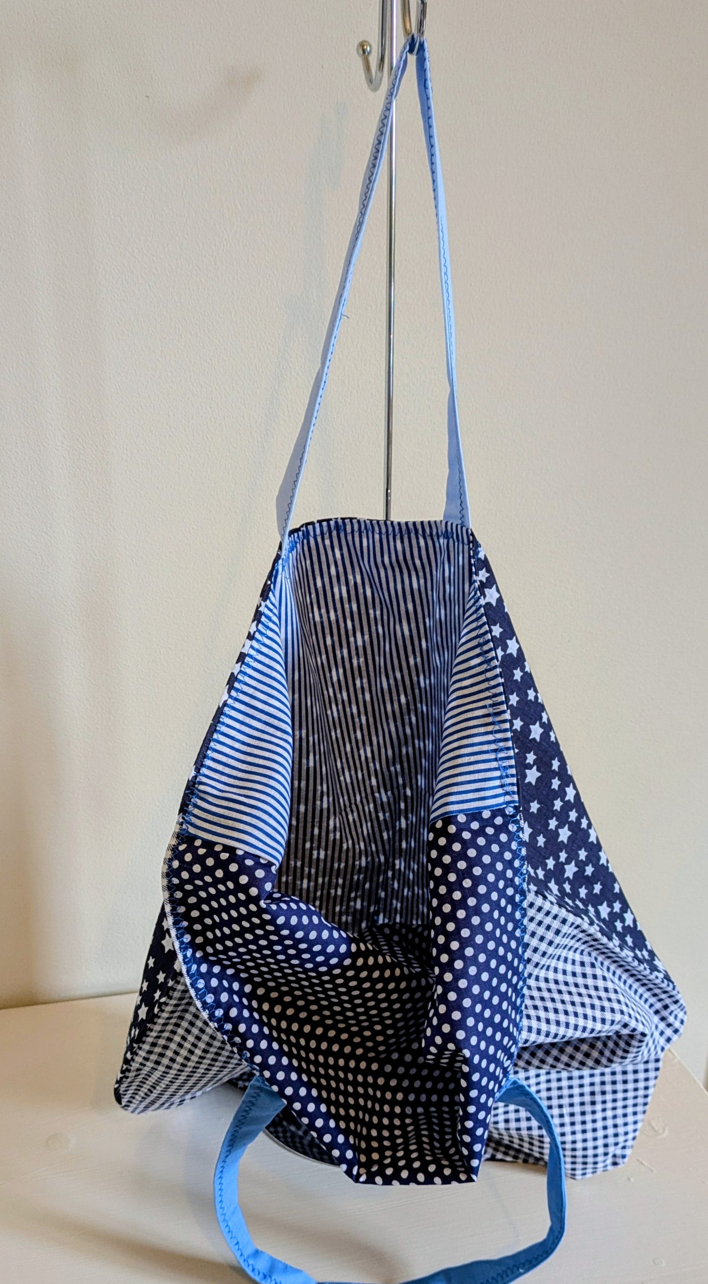 Blue tote bag by Harrie's Crafts with sturdy handles and spacious interior, perfect for everyday use.