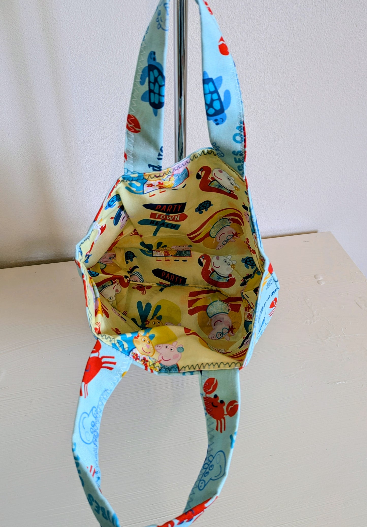 Peppa Pig tote bag by Harrie's Crafts featuring a colorful cartoon print of Peppa Pig and friends on durable fabric.