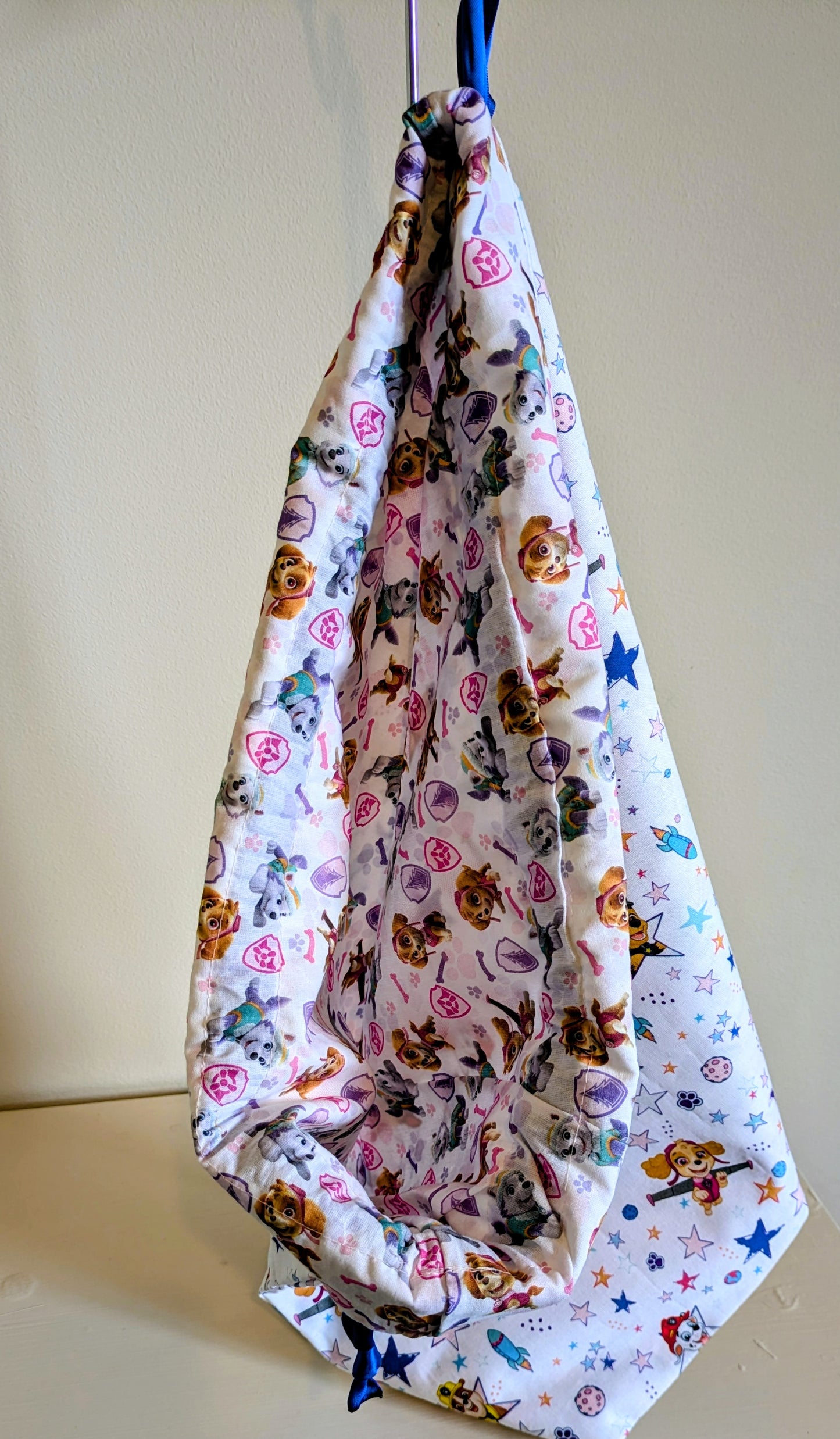 Paw Patrol drawstring bag by Harrie's Crafts featuring colorful Paw Patrol characters on a durable fabric background.