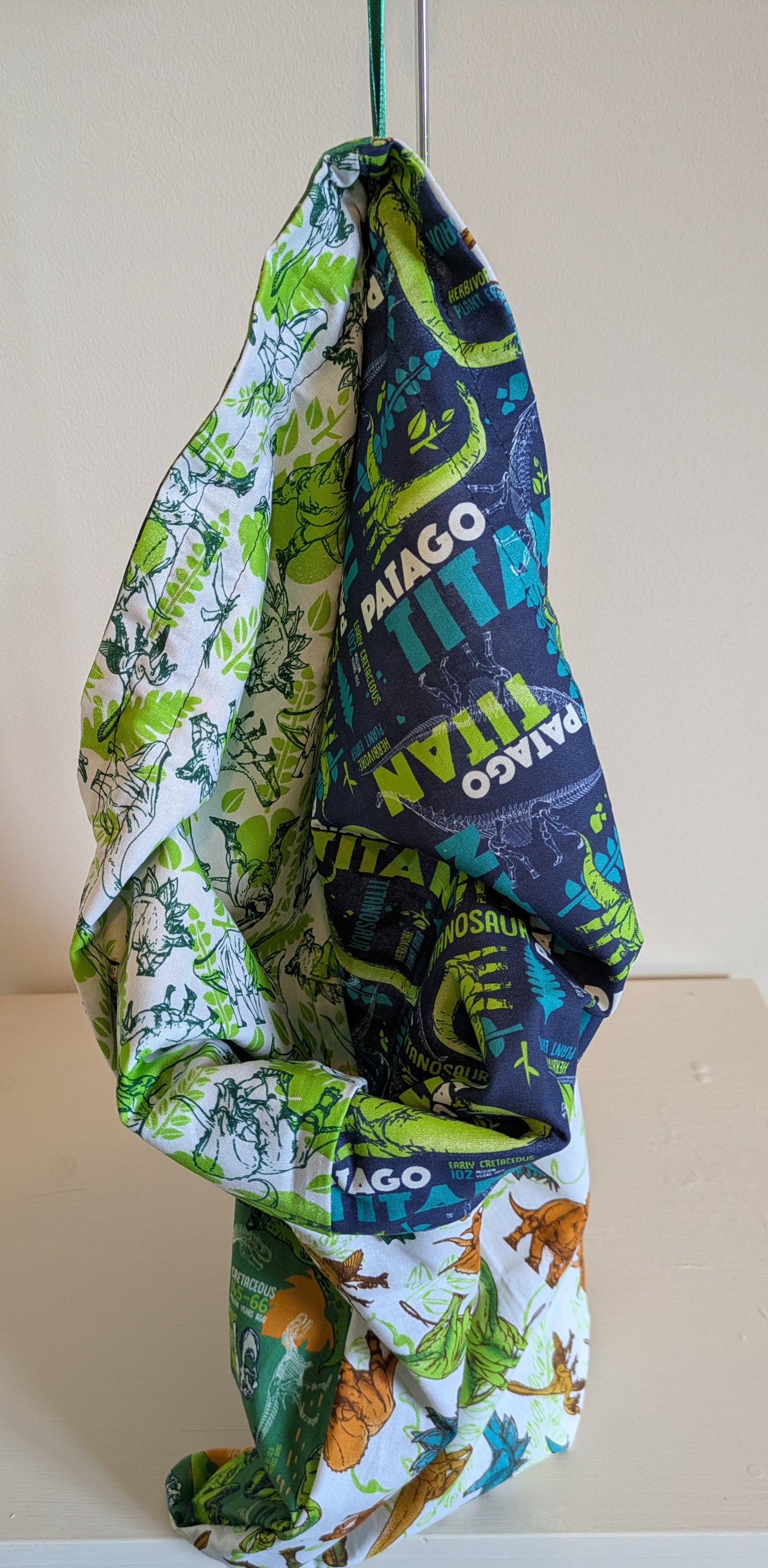 Dinosaur drawing bag by Harrie's Crafts featuring colorful dinosaur illustrations on a durable fabric bag.