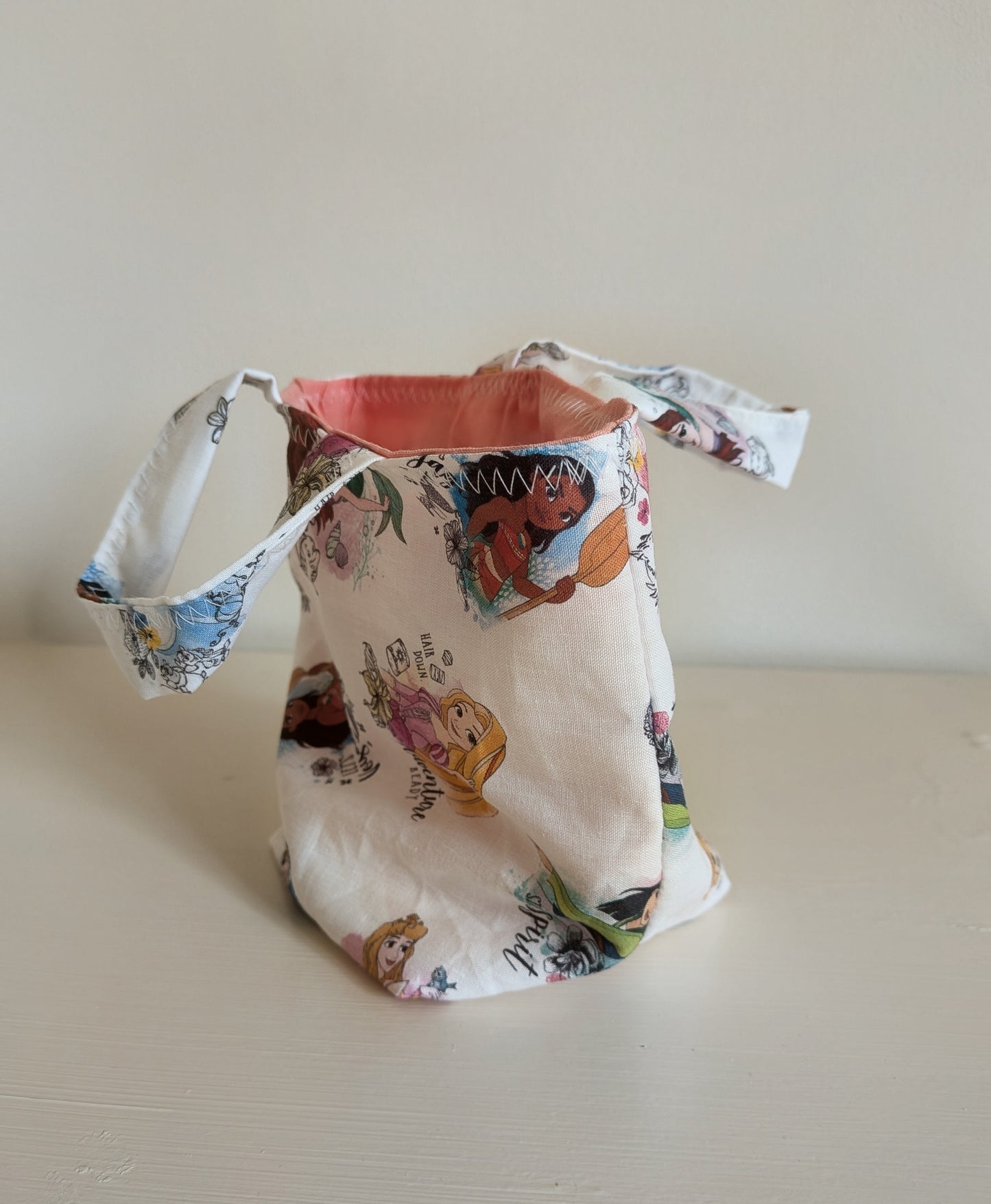 Harrie's Crafts Princess tote bag with colorful floral design and sturdy fabric handles for stylish carrying.