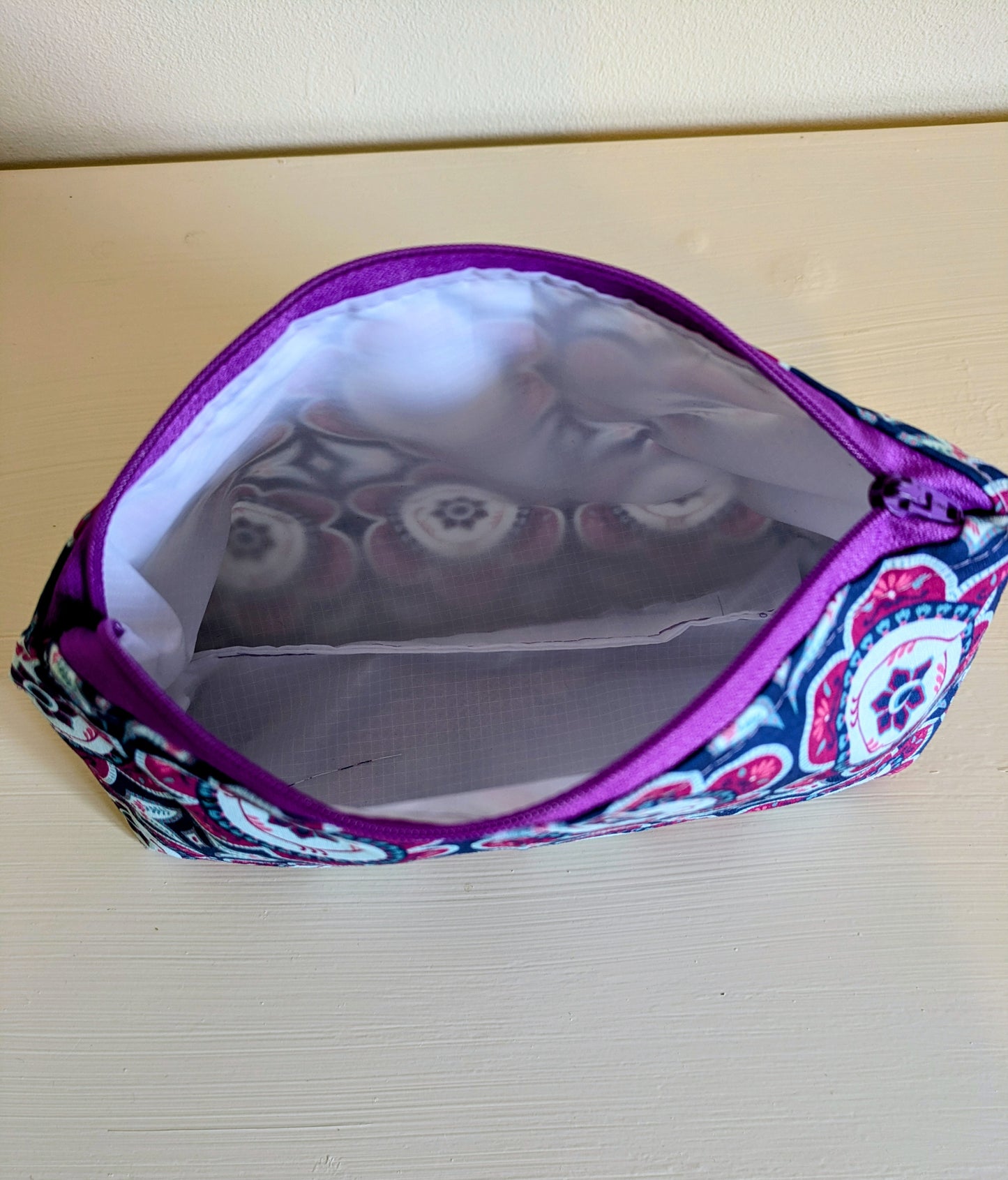 Multi-color flower wash bag by Harrie's Crafts featuring vibrant floral patterns and a compact, practical design.