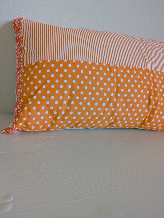 Orange patchwork cushion