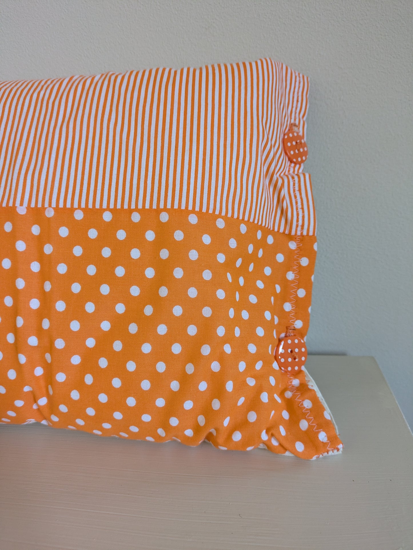 Orange patchwork cushion