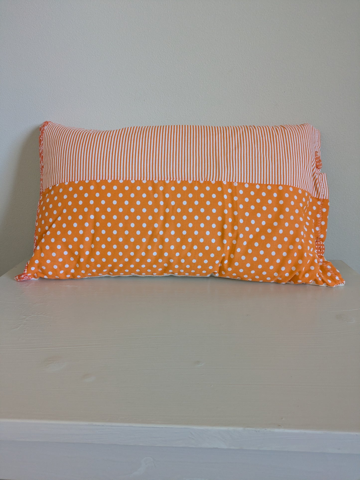 Orange patchwork cushion