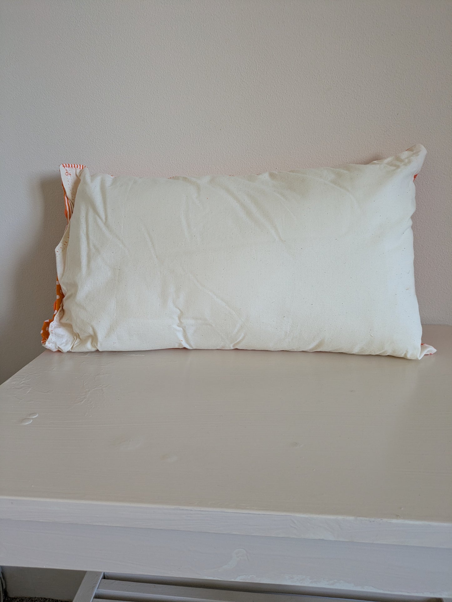 Orange patchwork cushion