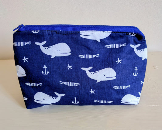 White and blue whale wash bag by Harrie's Crafts with a cute whale design and zipper closure.