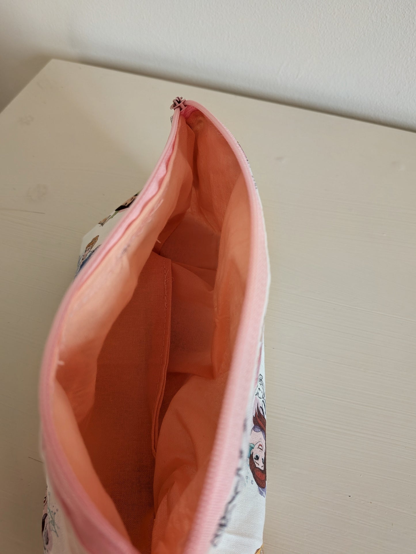 Harrie's Crafts Princess wash bag with pink and purple design, featuring a zipper closure and decorative princess motifs.