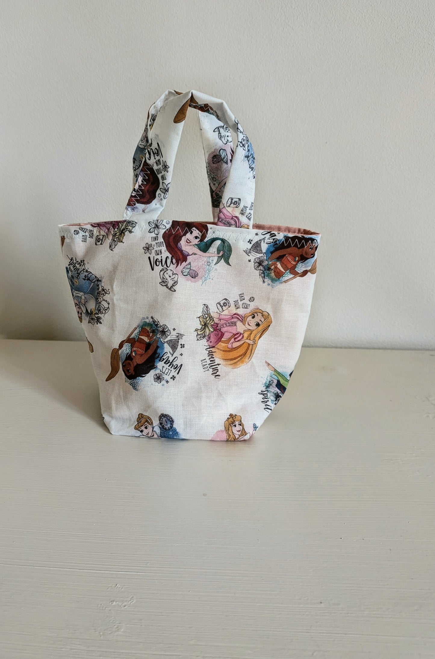 Harrie's Crafts Princess tote bag with colorful floral design and sturdy handles, ideal for carrying daily essentials.