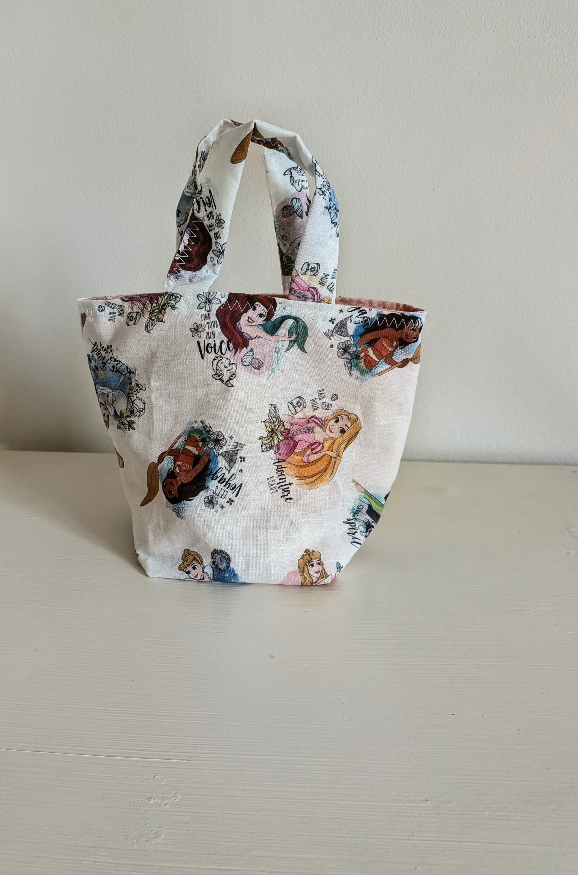 Harrie's Crafts Princess tote bag with colorful floral design and sturdy handles, ideal for carrying daily essentials.