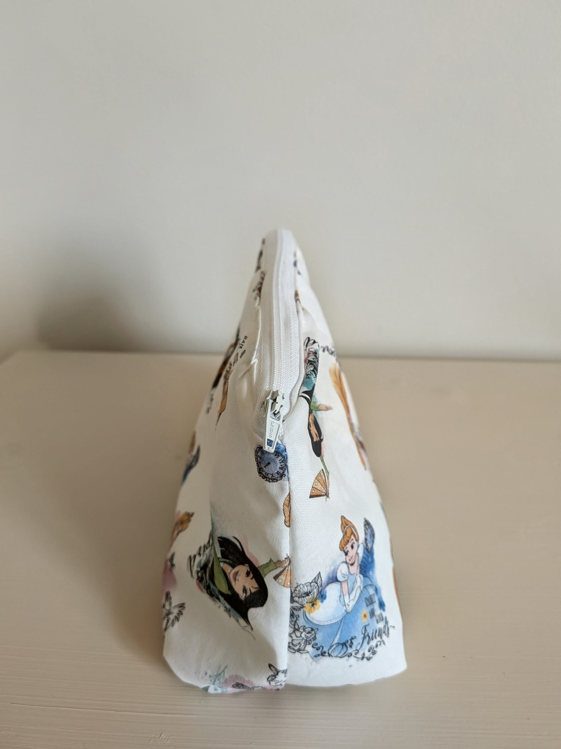 Harrie's Crafts Princess wash bag with waterproof lining, featuring a colorful princess design and a zipper closure.