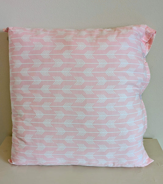 Pink cushion by Harrie's Crafts with soft fabric and decorative stitching, perfect for cozy home decor.