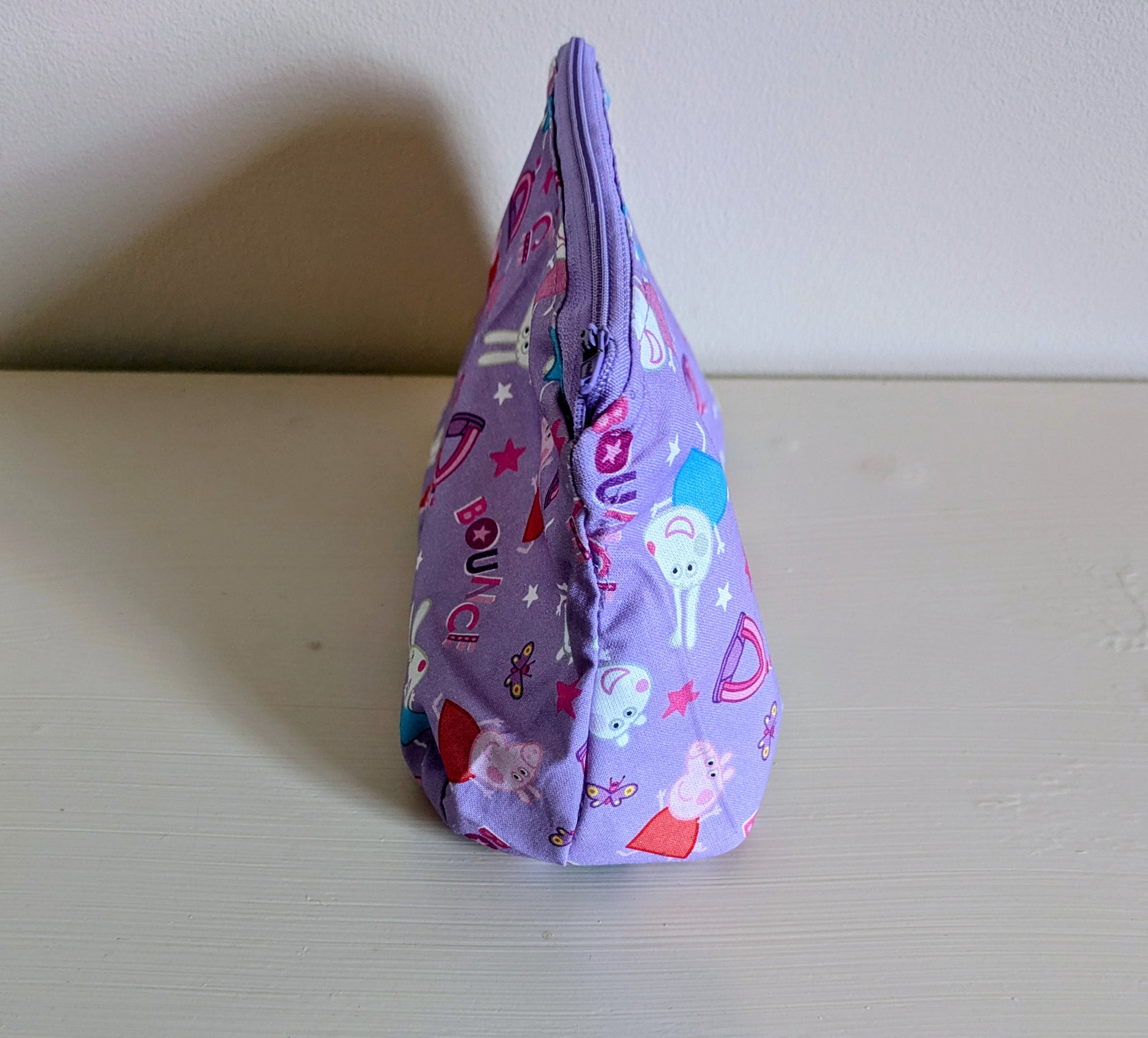 Peppa Pig wash bag by Harrie's Crafts featuring a colorful cartoon Peppa Pig design with a zipper closure.