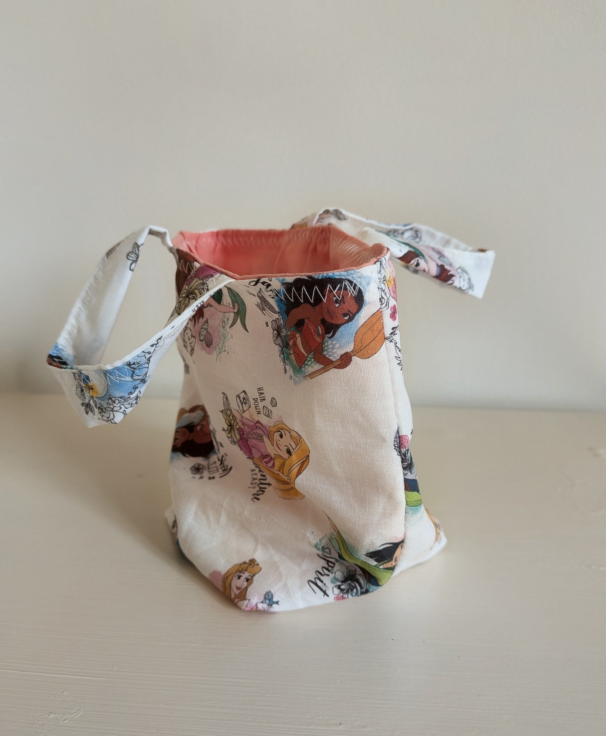 Harrie's Crafts Princess tote bag with colorful floral design and sturdy fabric handles for stylish carrying.