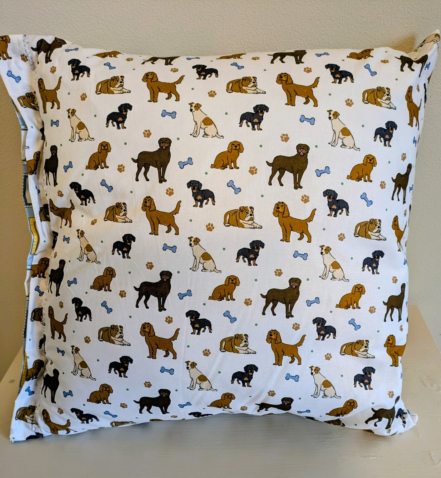 Dog print cushion by Harrie's Crafts featuring a soft fabric with a charming dog illustration and cozy design.
