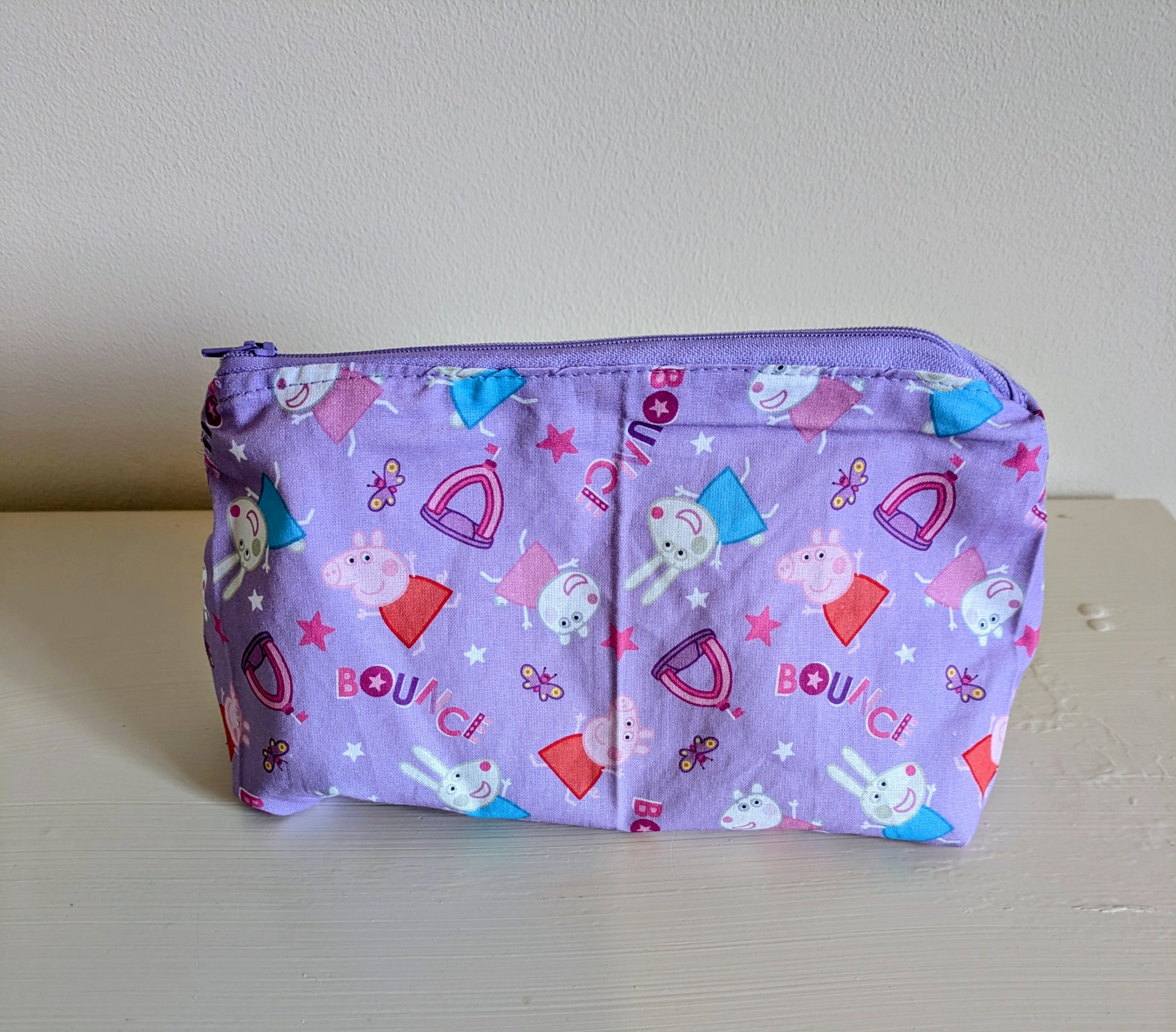 Peppa Pig wash bag by Harrie's Crafts featuring a colorful Peppa Pig design on a soft fabric bag.