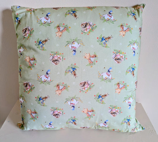 Peter Rabbit cushion by Harrie's Crafts featuring a soft fabric cushion with a charming Peter Rabbit design on a pastel background.