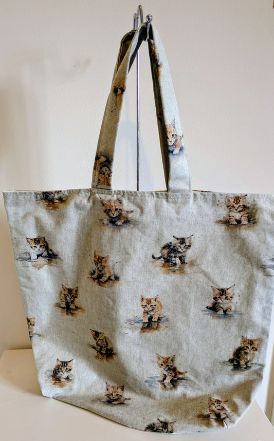 Harrie's Crafts kitten tote bag with colorful cat illustration and sturdy fabric handles, perfect for carrying essentials.