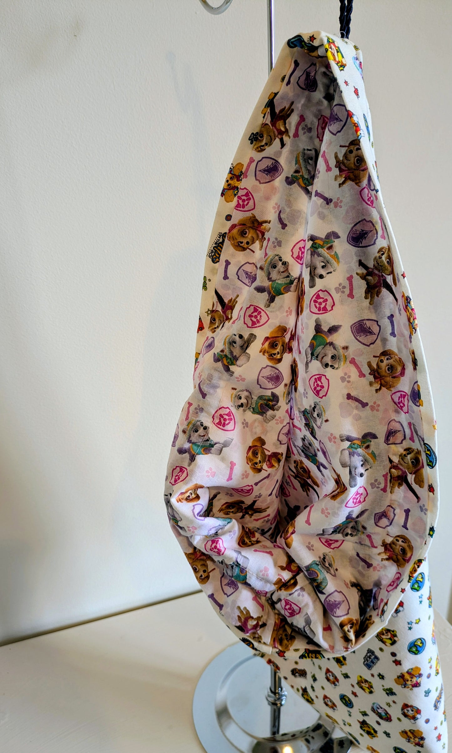 Paw Patrol drawstring bag by Harrie's Crafts featuring colorful cartoon characters and a convenient adjustable closure.