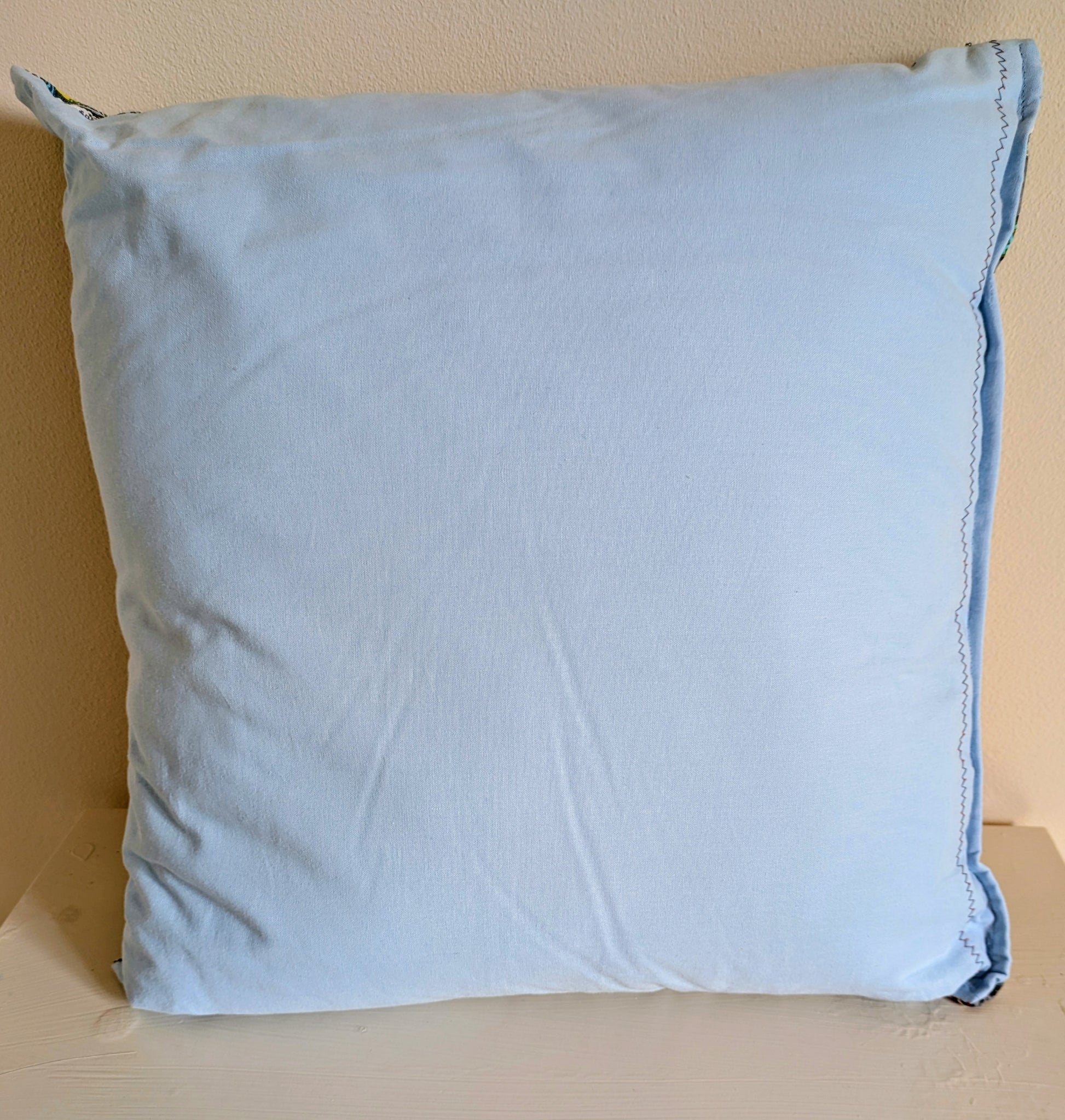 Harrie's Crafts Bateman cushion with geometric patterned fabric in neutral tones, plush filling for comfortable decor.