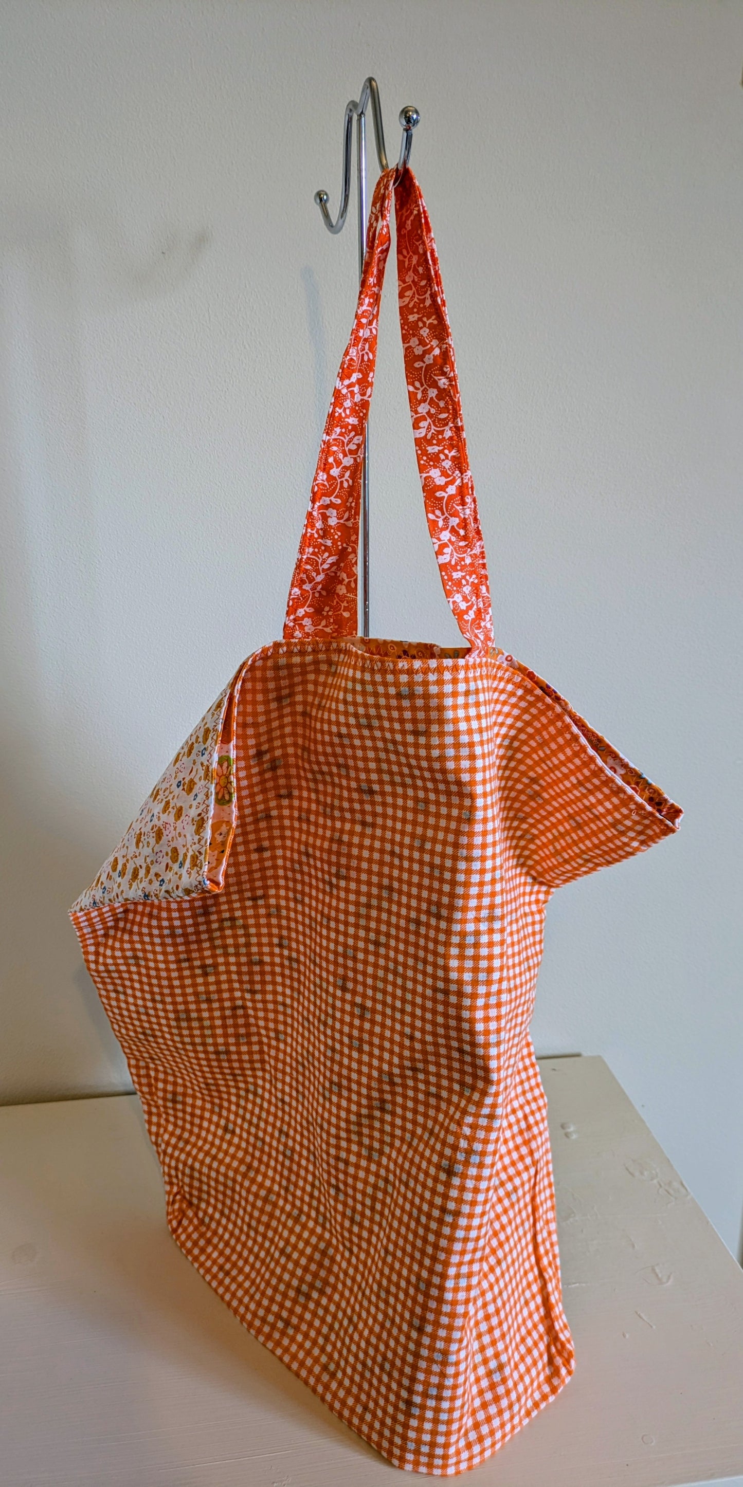 Orange tote bag by Harrie's Crafts featuring sturdy handles and spacious interior, perfect for everyday use.