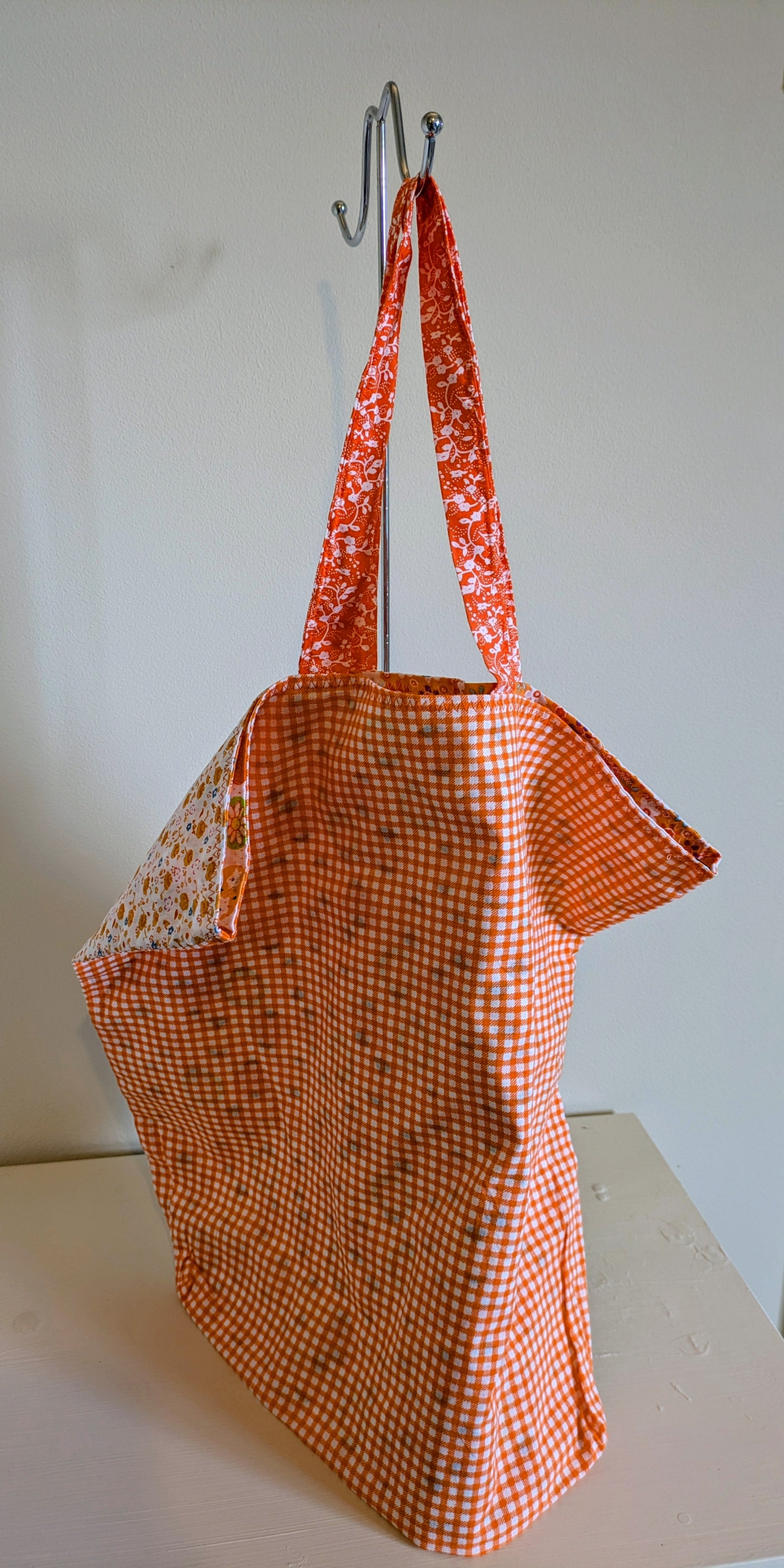 Orange tote bag by Harrie's Crafts featuring sturdy handles and spacious interior, perfect for everyday use.