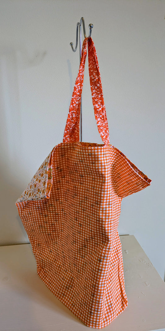 Orange tote bag by Harrie's Crafts featuring sturdy handles and spacious interior, perfect for everyday use.