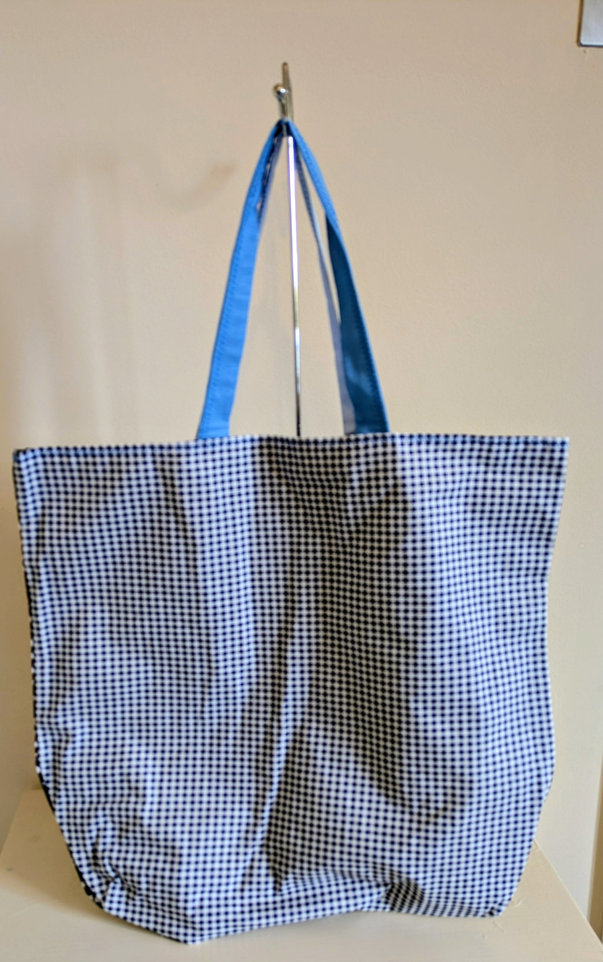 Blue tote bag by Harrie's Crafts with sturdy handles and spacious interior, perfect for everyday use and casual outings.