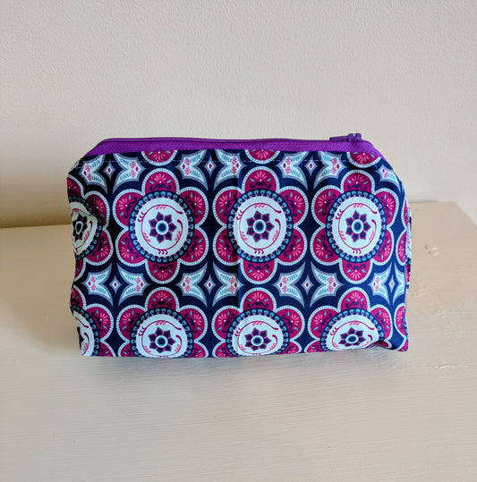 Harrie's Crafts multi-color flower wash bag with vibrant floral pattern and zipper closure, ideal for travel and toiletries.