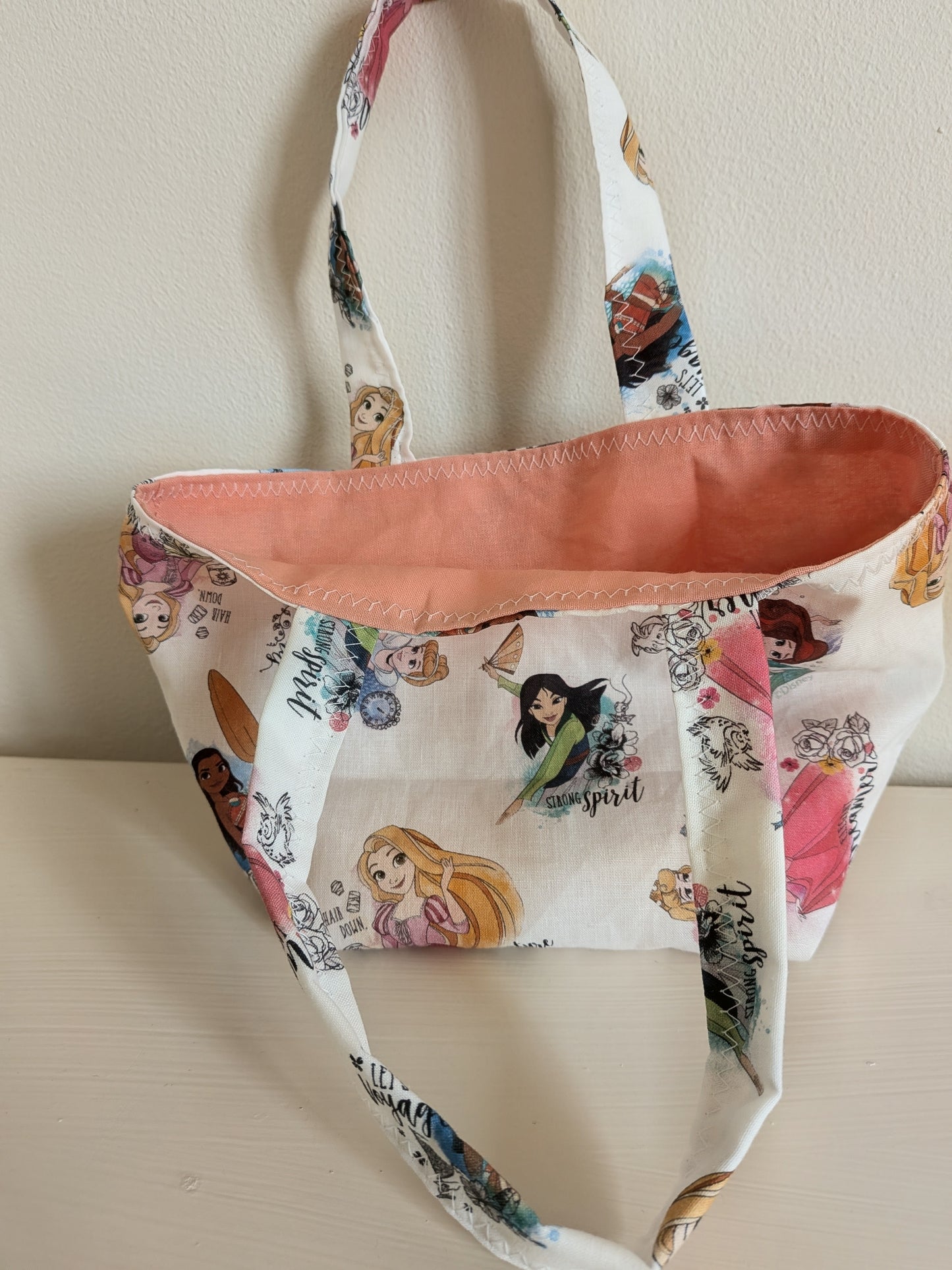 Harrie's Crafts princess tote bag with colorful floral design and sturdy handles, perfect for casual carrying.