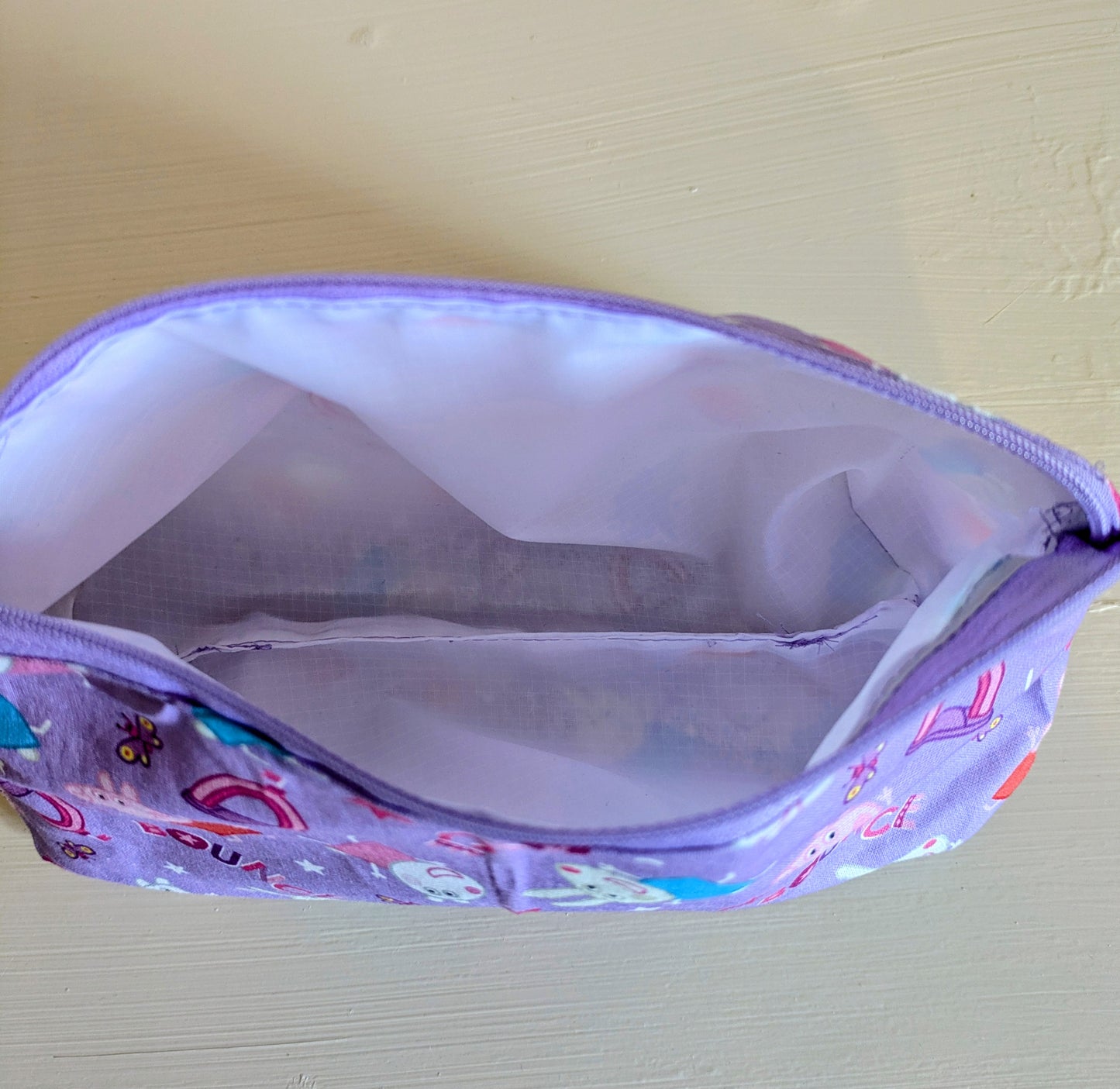 Peppa Pig wash bag by Harrie's Crafts featuring a colorful Peppa Pig design on a fabric toiletry bag for kids.