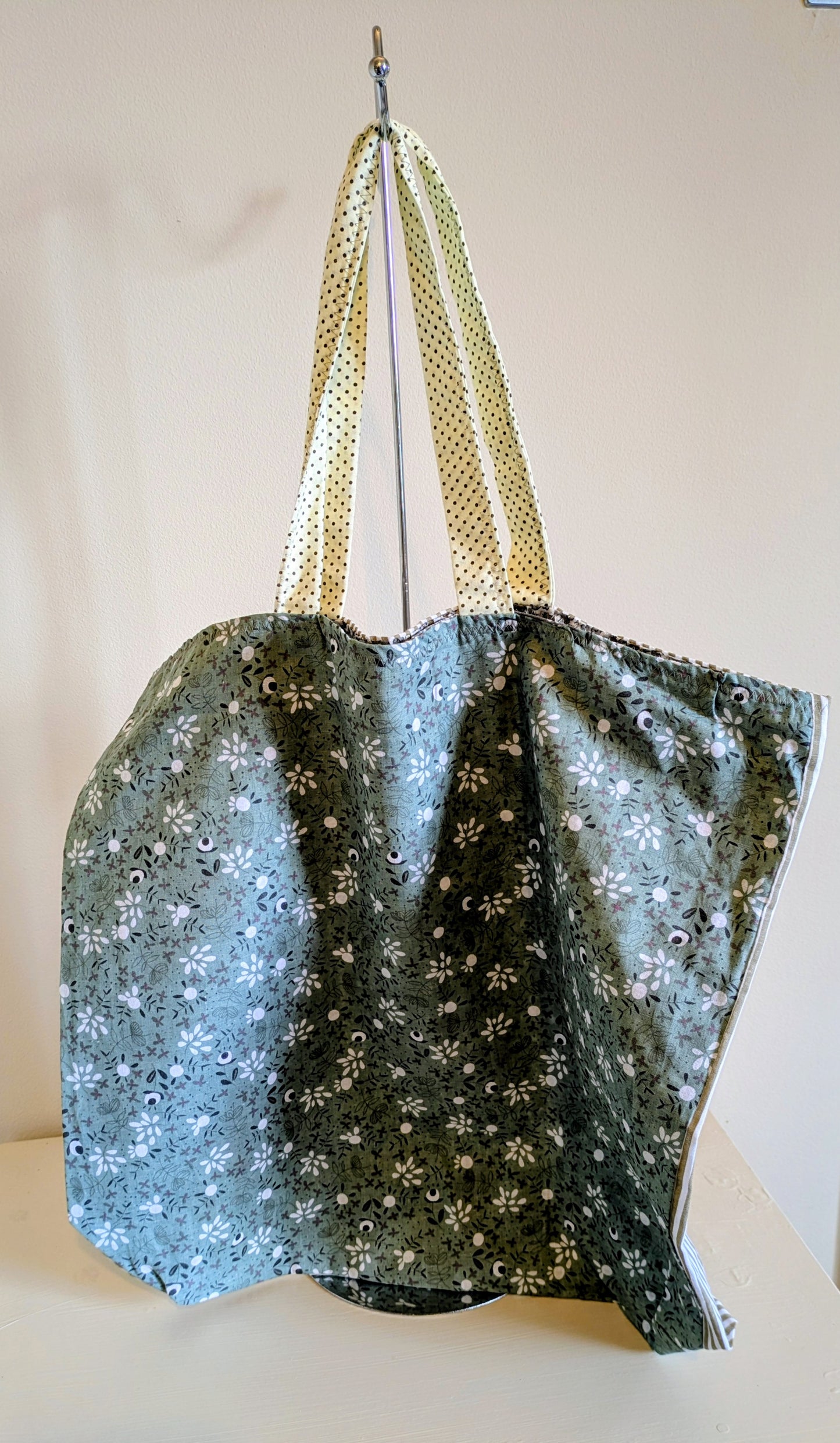 Green tote bag by Harrie's Crafts with sturdy handles and spacious interior, perfect for daily use and eco-friendly shopping.